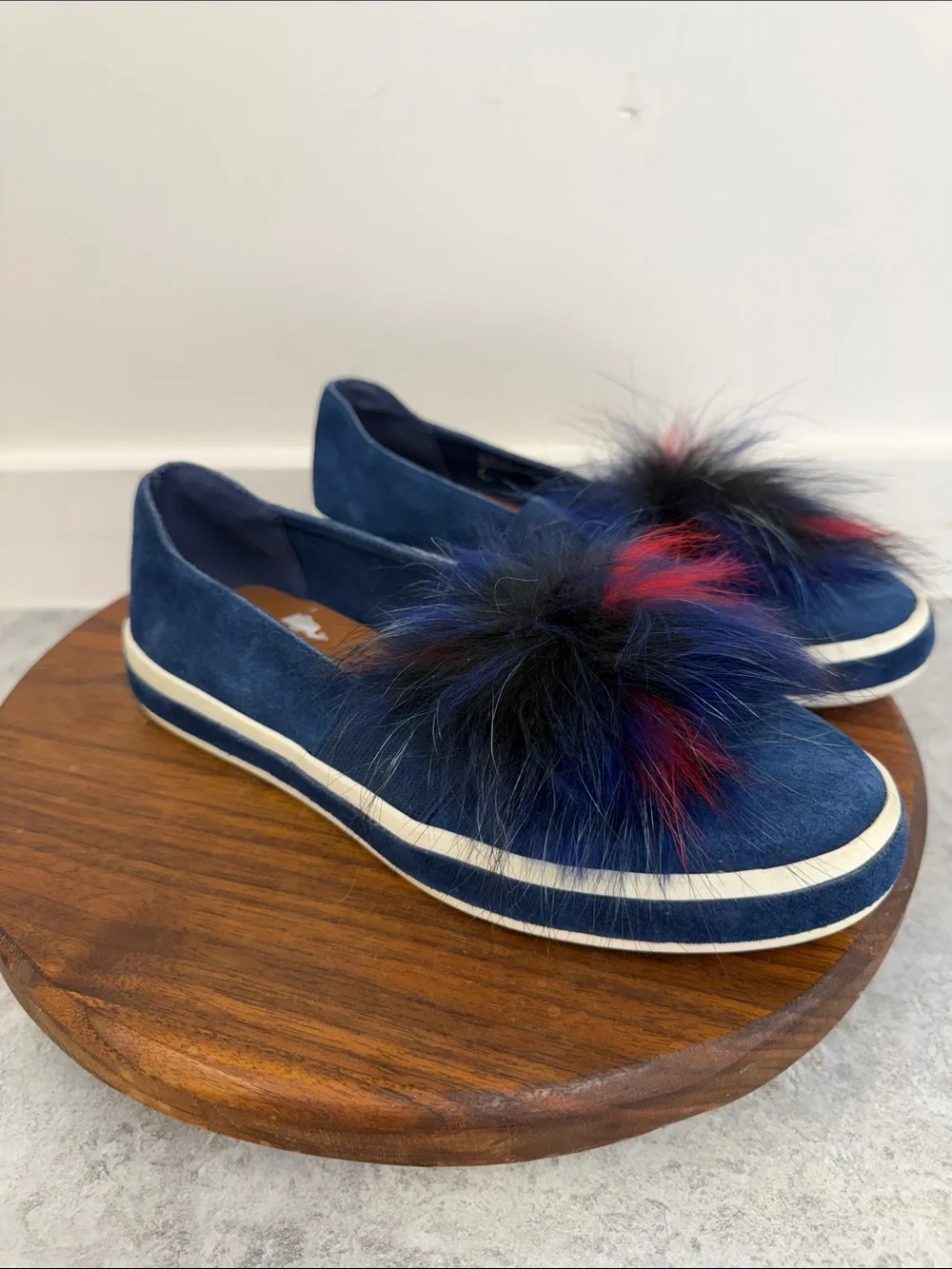 Sondra Roberts Navy Slip-On Sneakers with Red and Black Faux-Fur Poms‎